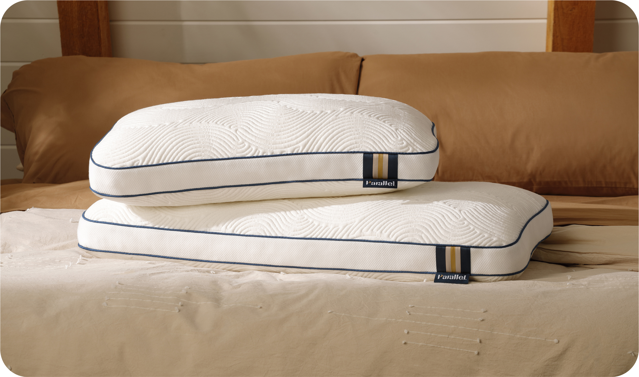 2 high profile high-end pillows stacked on stylish bed