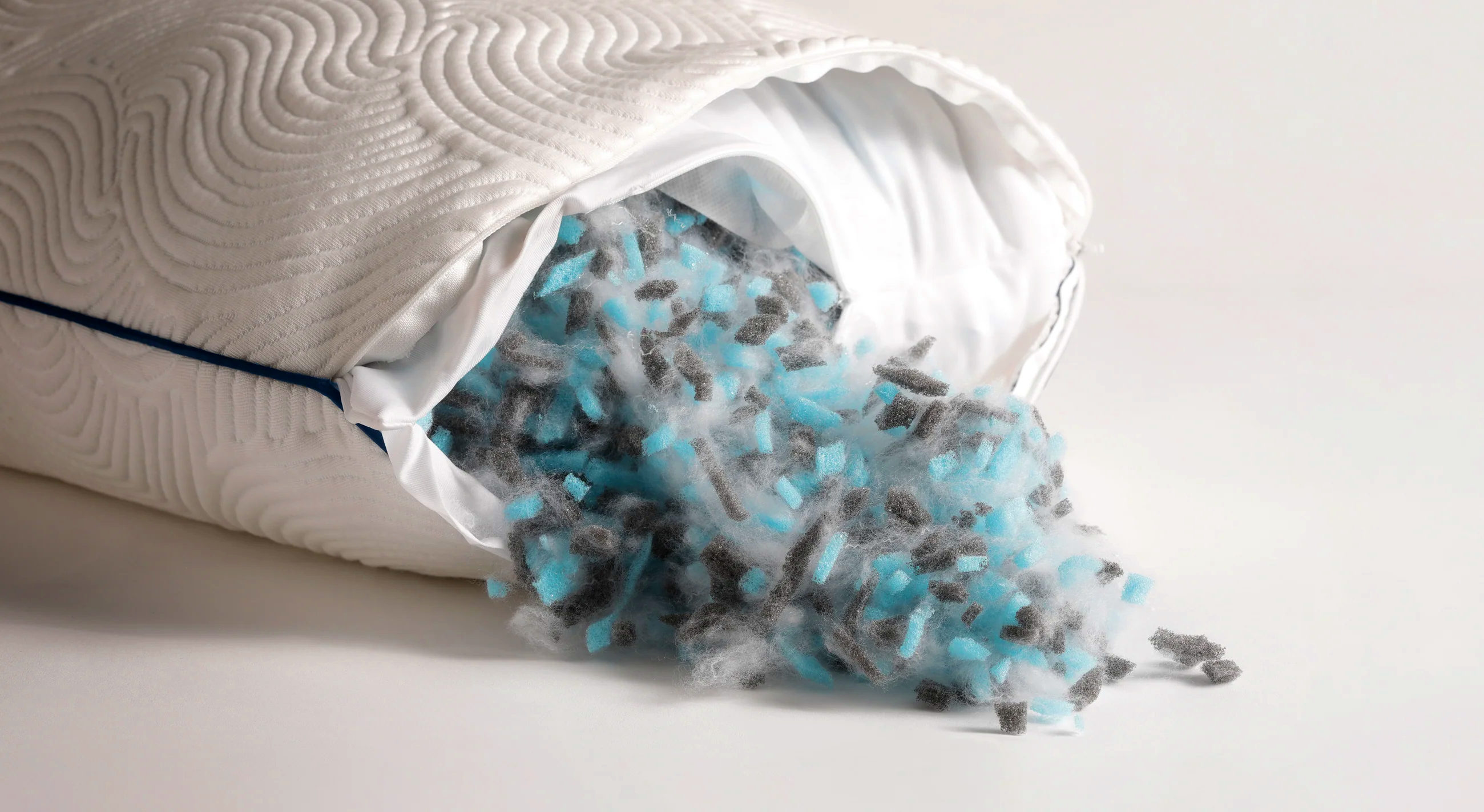 Adjustable fill spilling out of Parallel Pillow with open zipper